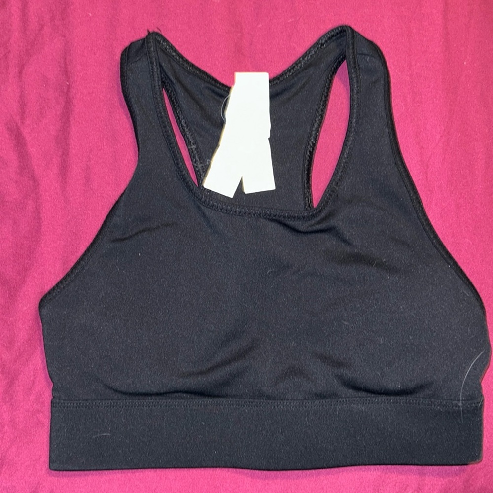 Black Fabletics sports bra with phone pocket in the back.